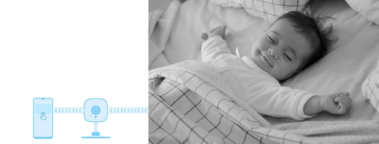 A baby is asleep with smile on his/her face.